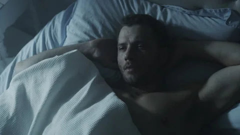 Soldier Lying in the bed and thinking seriously about something Stock Footage 264349772