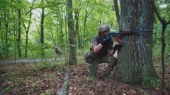 Young girl in short shorts with gun near, Stock Video