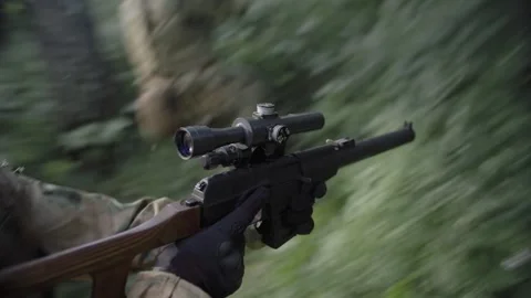 Soldier on military operation in combat mode with machine gun Stock Footage 327456834