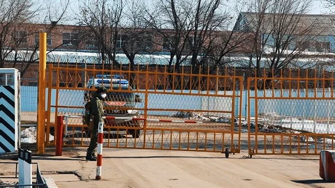 A soldier opens the gate Stock Footage 128197299