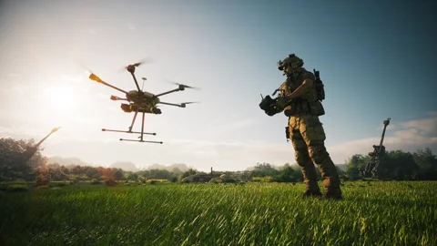 A soldier operates a drone in a field Stock Footage 337420900