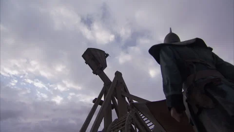 Soldier operating Trebuchet for throwing projectiles - Reenactment Stock Footage 202913459