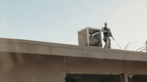 Soldier Patrolling Rooftop Stock Footage 47923196