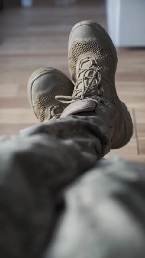 A soldier in pixelated uniform is resting during his vacation. Video stock 324900500
