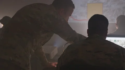 Soldier Pointing at a Computer Screen | Stock Video | Pond5