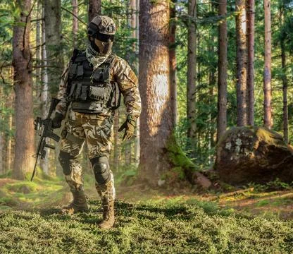 Soldier posing in forest. Stock Photos