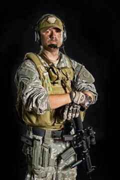 Soldier posing with a gun Stock Photos