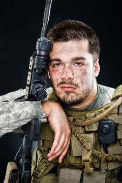 Soldier posing with a gun Stock Photos