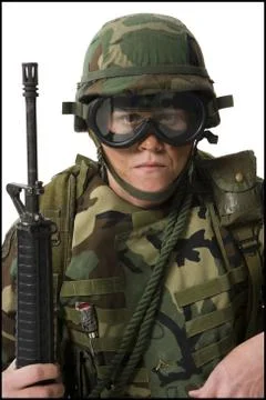 Soldier posing with weapon Stock Photos
