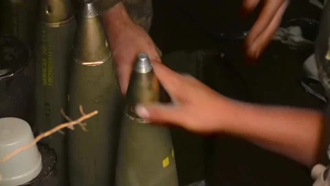 A soldier prepares ammunition for use. Preparation for the shot. Preparation for Stock Footage 259797385