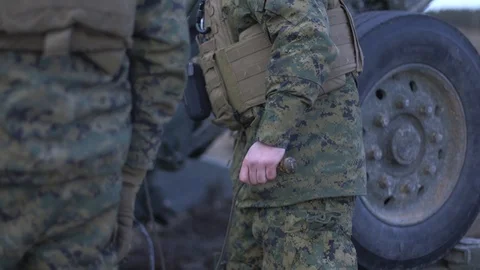 Soldier pulling trigger on M777 Howitzer Stock Footage 104491011