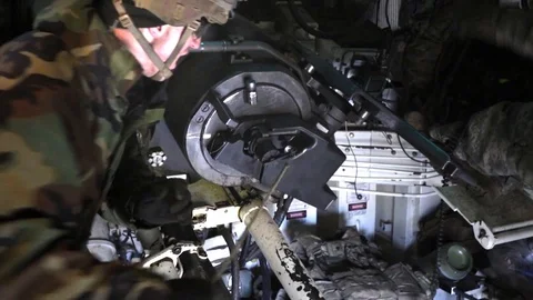 Soldier pulling trigger on Paladin battle tank cannon 動画素材 102097145