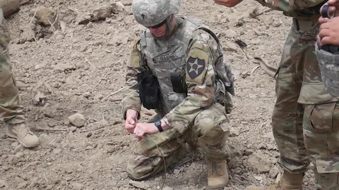 Soldier pulls fuse wire during training at demo range Stock Footage 91526986