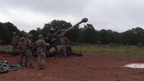 Soldier pulls trigger on M777A2 Howitzer during live fire exercise 動画素材 93078148