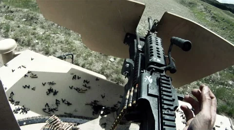 Soldier puts down machine gun bullet | Stock Video | Pond5