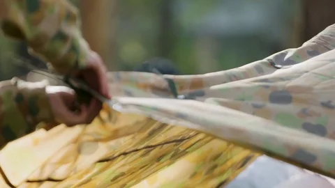 Soldier putting up tent Stock Footage 77015310
