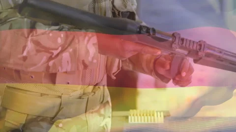 Soldier reaching forward selecting shell then loading shotgun shells preparing 動画素材 311216180