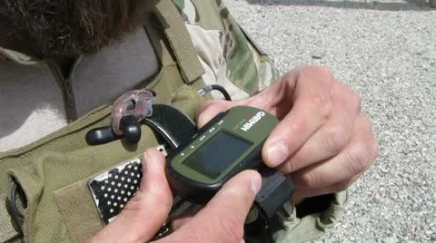 Soldier reading GPS  device(HD) C Stock Footage 8953314