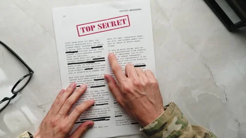 Soldier Reads Secret Documents. Top view Stock Footage 253900014