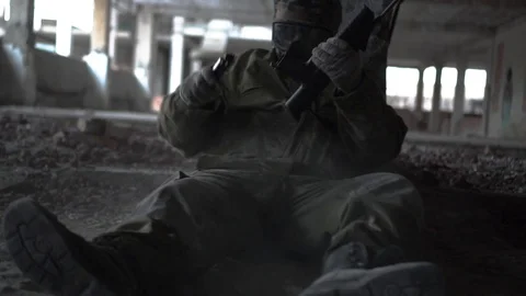 Soldier reloads the machine for cover Stock Footage 101690745