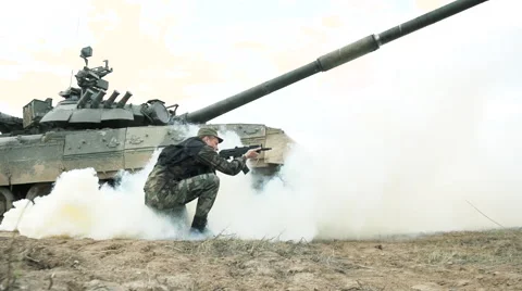 The soldier runs into the attack in battle enemy in explosion smoke. Slow motion Video stock 58288079