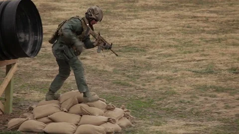 Soldier runs by an explosion Video stock 76940013