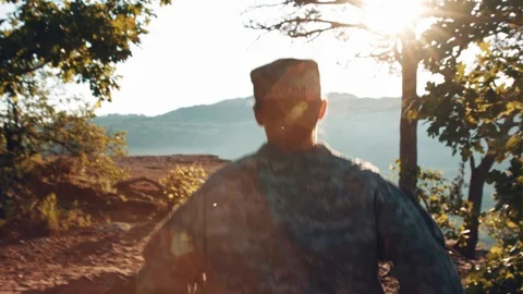 A Soldier Runs Through A Forest Stock Footage 87429797