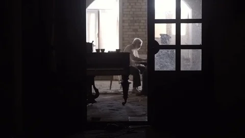 Soldier of the Russian army interrogates a suspect, an elderly man with a beard Stock Footage 100372611