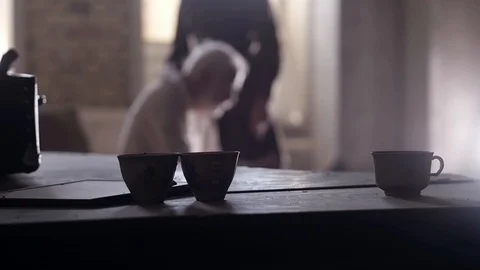 Soldier of the Russian army interrogates a suspect, an elderly man with a beard Stock Footage 100372651
