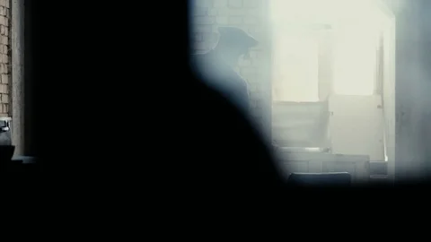 Soldier of the Russian army interrogates a suspect, an elderly man with a beard Video stock 100372713