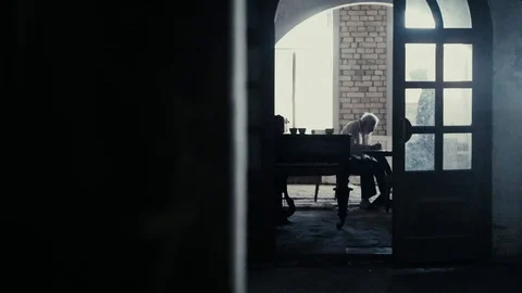 Soldier of the Russian army interrogates a suspect, an elderly man with a beard Stock Footage 100372812