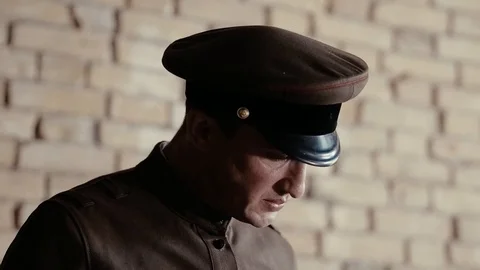 Soldier of the Russian army interrogates a suspect, an elderly man with a beard Stock Footage 100372914