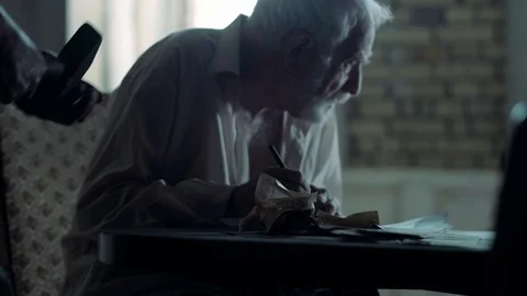 Soldier of the Russian army interrogates a suspect, an elderly man with a beard Video stock 100372932