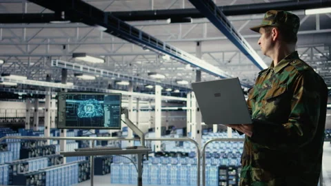 Soldier in server hub using laptop to deploy AI tech, modernizing defense Stock Footage 314804803