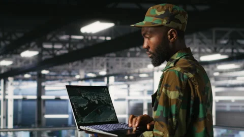 Soldier in server room uses geospatial data to support emergency operations Stock Footage 310785952