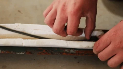 Soldier setting explosive and exploding it in an open field 库存影片 114019452