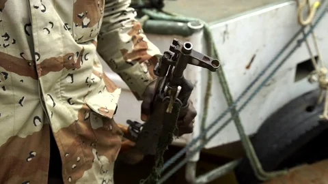 A soldier shows his weapon to the camera, detail. Stock Footage 71191650