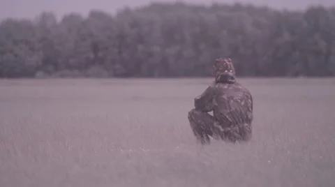Soldier sitting in grass Stock Footage 21892847