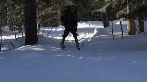 Soldier skiing with a heavy backpack in the snow Stock Footage 110825981