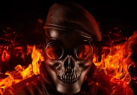 Soldier in skull mask, glasses and beret face front view closeup. Stock Photos