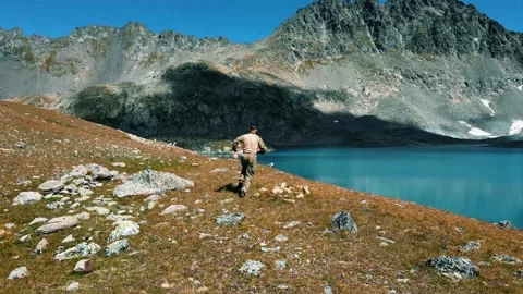 A soldier of a special operations squad in a multicam quickly runs Stock Footage 138442582