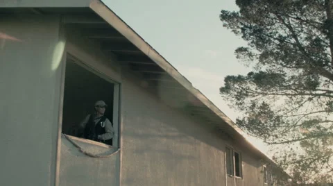 Soldier Standing in Top Window Video stock 47923272