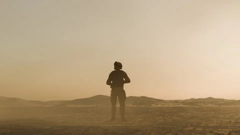 Soldier stands in dust storm Stock Footage 276359316