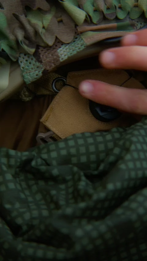 A soldier in tactical gear testing the BOA suspension system  Video stock 337829236