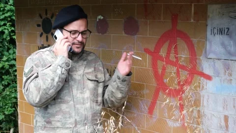 Soldier talking on the mobile phone Stock Footage 255144645