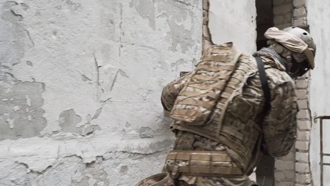 Soldier throws a grenade into the building. airsoft. 4k Stock Footage 124706511