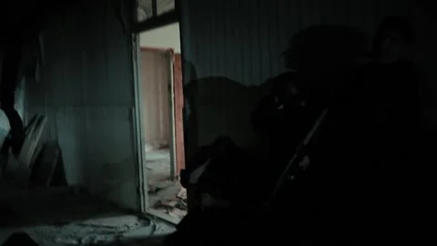 A soldier throws a grenade inside the room. Stock Footage 195988013