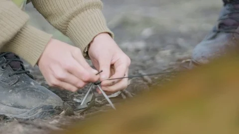 Soldier tying knot Stock Footage 77015050