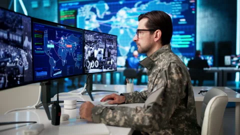 Soldier Uses Advanced Computer Technology In Military Command Center Stock Footage 335457767