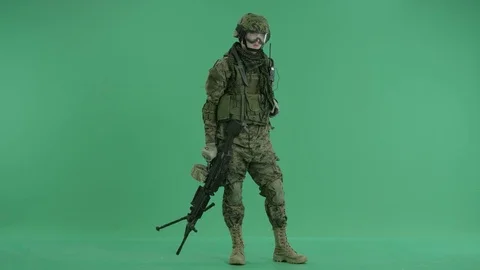 Soldier using gas mask and looking around at green screen 動画素材 70404855